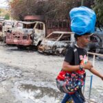 202403americas_haiti_torchedcars.jpg